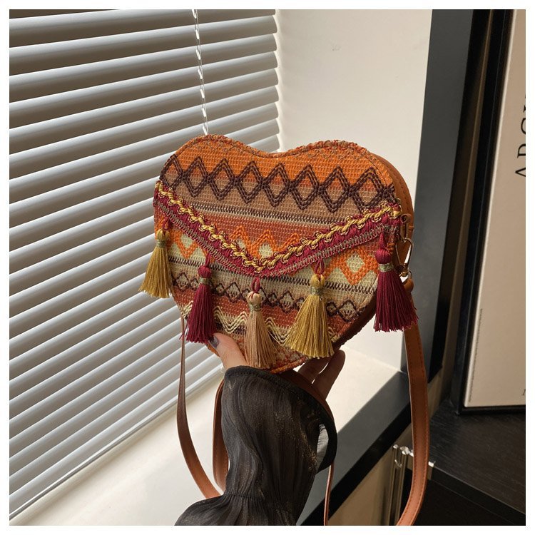 Mayorista bolsos de estilo nacional de mujer 2024 moda nueva mochila en forma de corazón bolsos de hombro bohemios transfronterizos