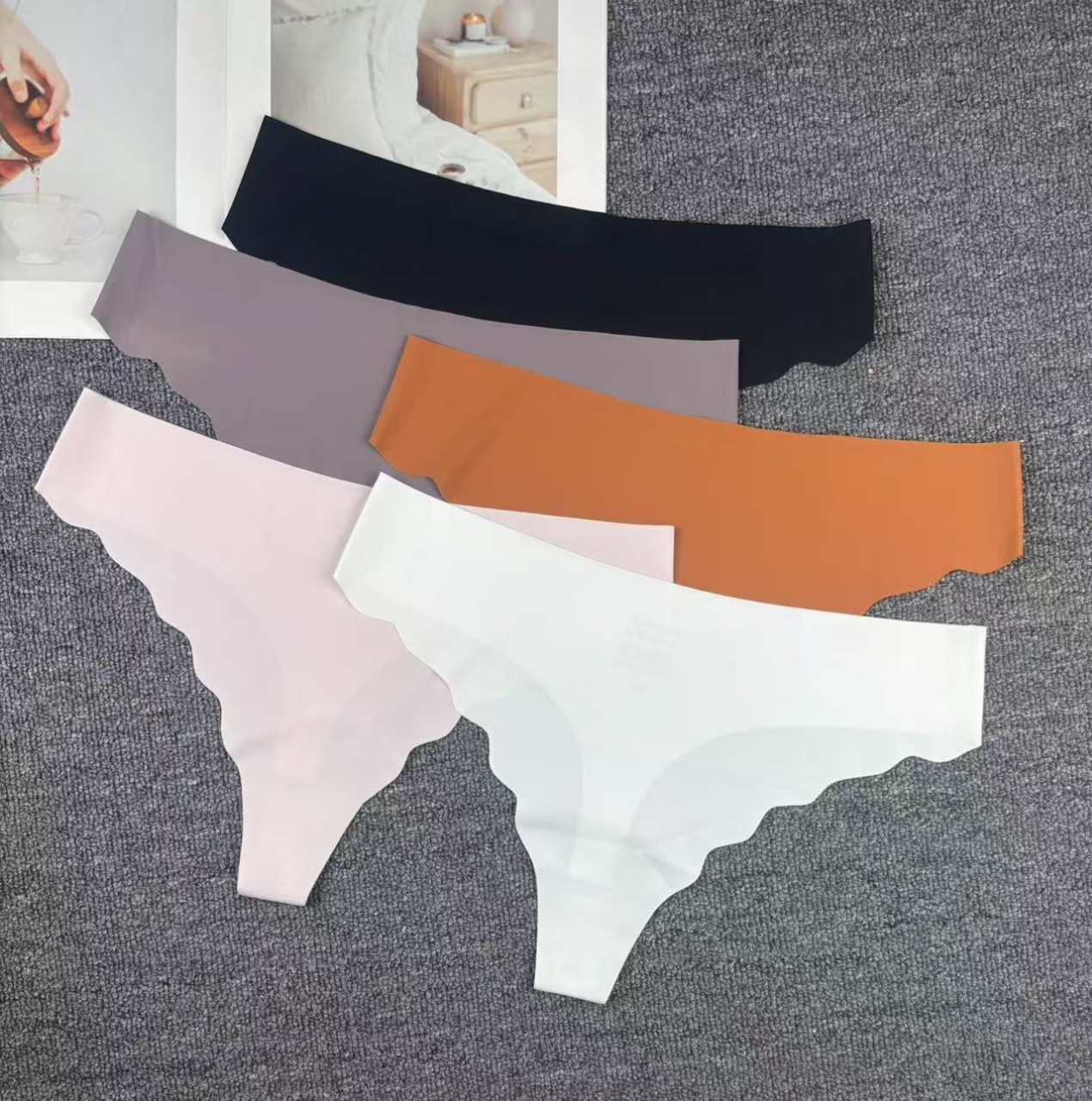 Inventario de bajo precio de alta calidad tanga sin costuras europea y americana ropa interior sexy para mujer 11001