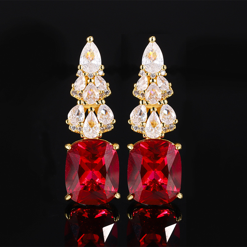 Pendientes de corindón rojo dorado