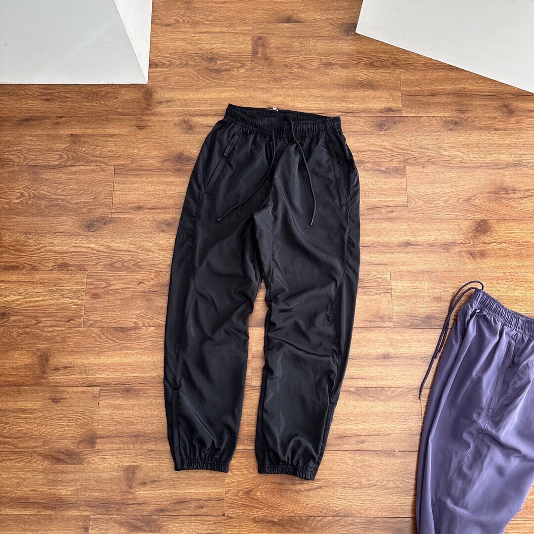 Pantalones deportivos tejidos primavera-verano pareja nuevo nylon rápido secado abrazamiento de pies tejido pantalones deportivos de doble capa para hombre