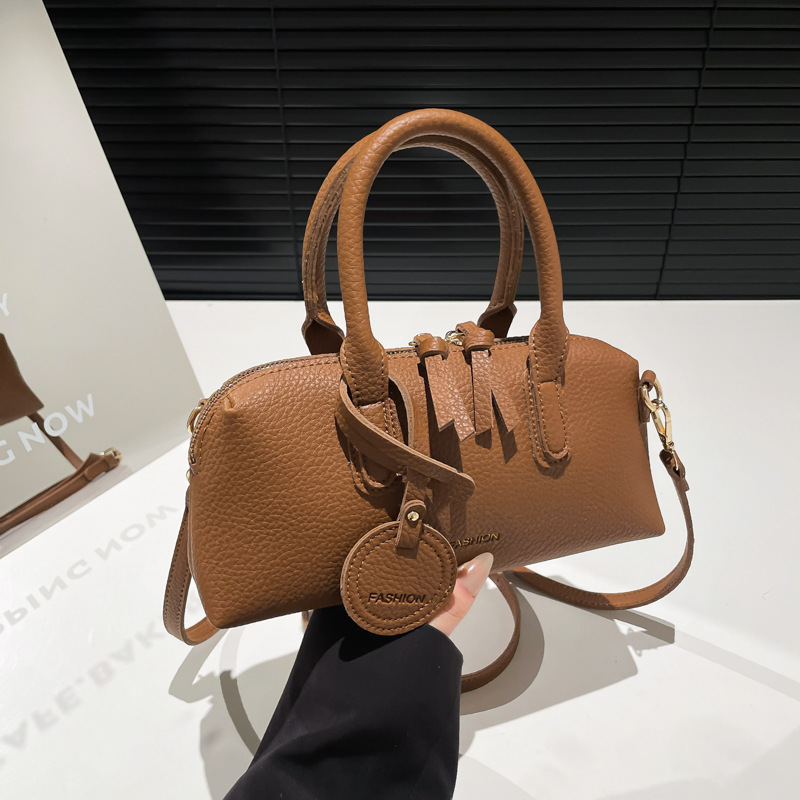 Bolso de moda coreano 2025 primavera y verano nuevo bolso femenino bolso de hombro con patrón de lichi casual bolso de mensajero de letras simples