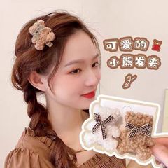 かわいいぬいぐるみの熊のヘアピンの少女秋冬の蝶結びのサイドの前髪のカモの口は韓国のネットの赤い頭の飾りを挟みます。