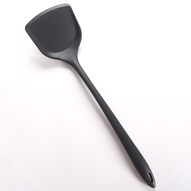 Stock de fábrica utensilios de cocina de silicona sartén antiadherente juego de pala mango largo cuchara de silicona de una pieza