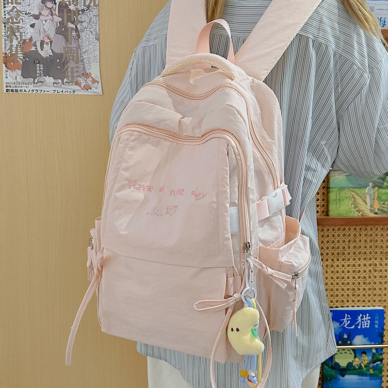 日系风轻便纯色双肩包户外旅游大容量背包休闲百搭大学生通勤书包