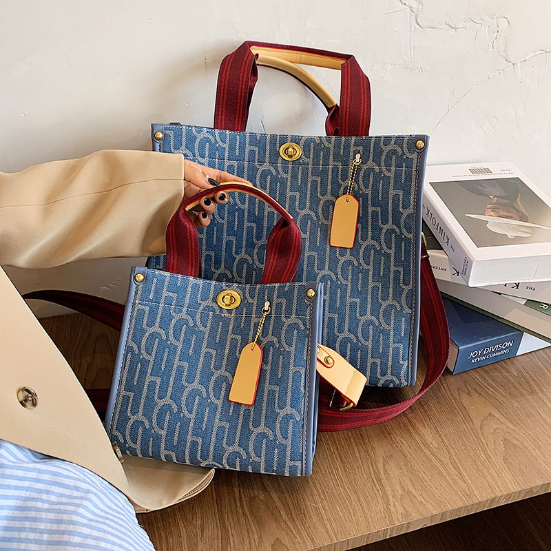 Bolso bandolera para mujer, nuevo bolso tote de lona con estampado de letras, de gran venta, bolso de hombro de textura de alta calidad.