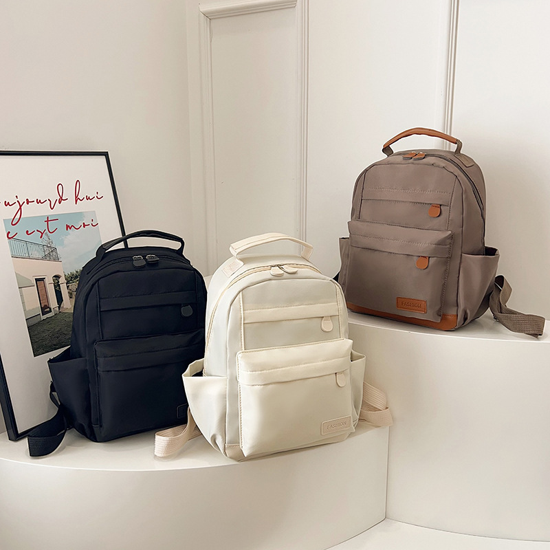 2025 primavera nueva mochila simple de color sólido mochila de estudiantes de escuela primaria mochila de viaje al aire libre