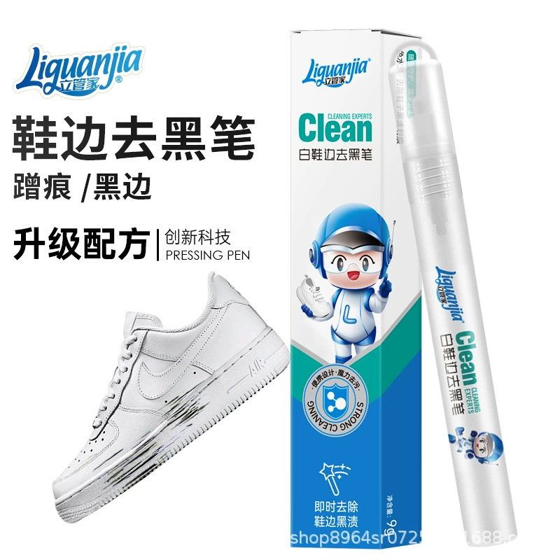 Черная ручка, черная ручка, черный агент, рядом с белыми туфлями