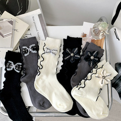 Xiaoxiangfeng light luxury bow flower socks women's spring and autumn niche personality fungus Japanese style JK pile stockings