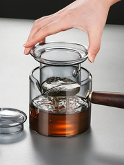 Glass side-handle teapot for home use, heatable and high-temperature resistant, kung fu tea set with tea-water separation and filtering function.