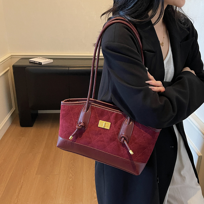 Bolsa de mano transfronteriza de alto nivel, bolso de celosía casual para mujeres, otoño y invierno 2025, nueva bolsa de hombro casual de gran capacidad.