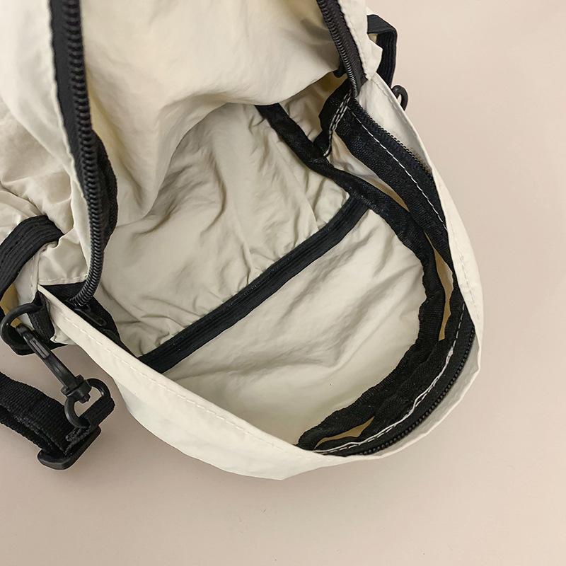 Solid-color nylon fabric bag for women, Spring 2025 new niche waist bag, ins casual pleated phone bag, crossbody bag for women undefined
