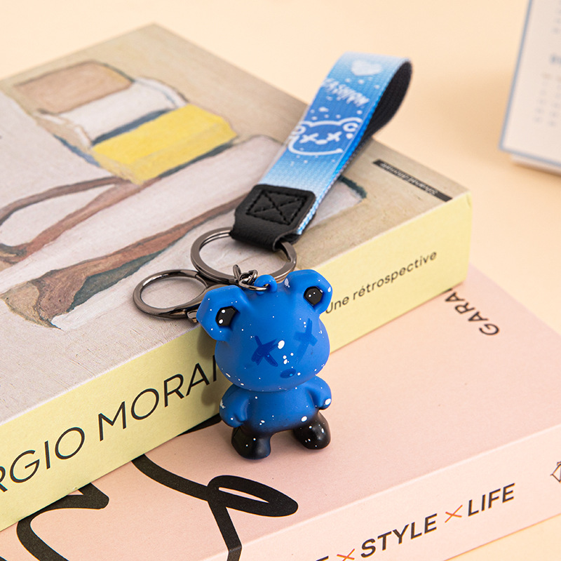 Creativo, colorido, violento, muñeca de oso de dragón, método de lucha de perros, llavero de muñeca de moda, llavero de personalidad de coche