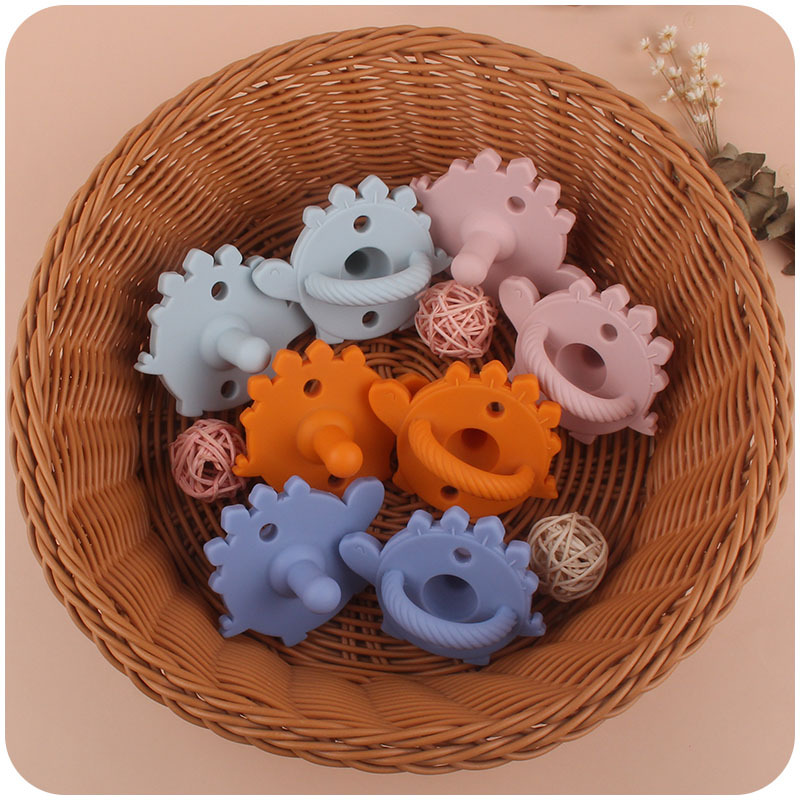 Nuevo bebé de dibujos animados dinosaurio de silicona chupete dientes de bebé juguetes de molienda Amazon AliExpress