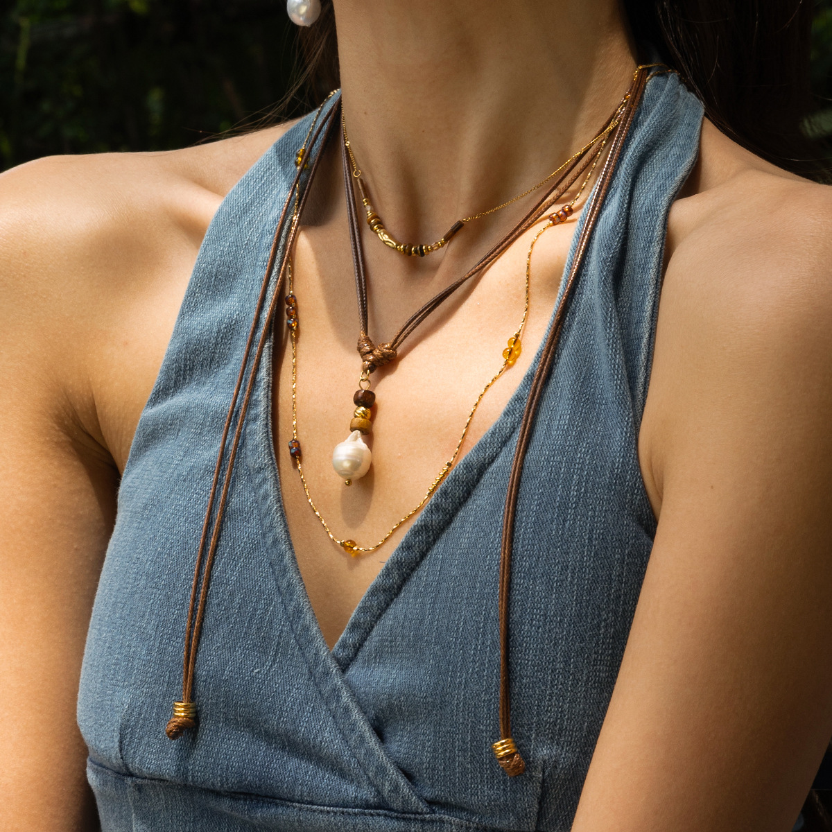Collar de acero inoxidable TENA Europa y América de lujo ligero nicho largo collar de perlas de cuerda ligero lujo alto sentido de venta caliente transfronteriza