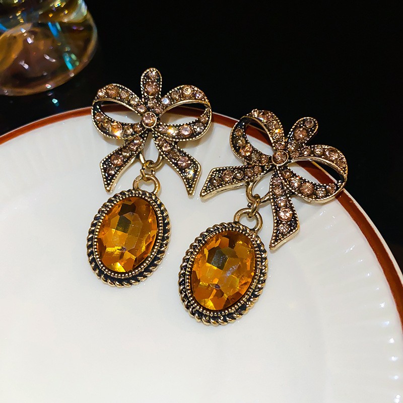 Aguja de plata Pendientes de lazo de diamantes coreanos Pendientes de temperamento de moda de todo fósforo Pendientes de diseño de nicho Sentido de lujo ligero