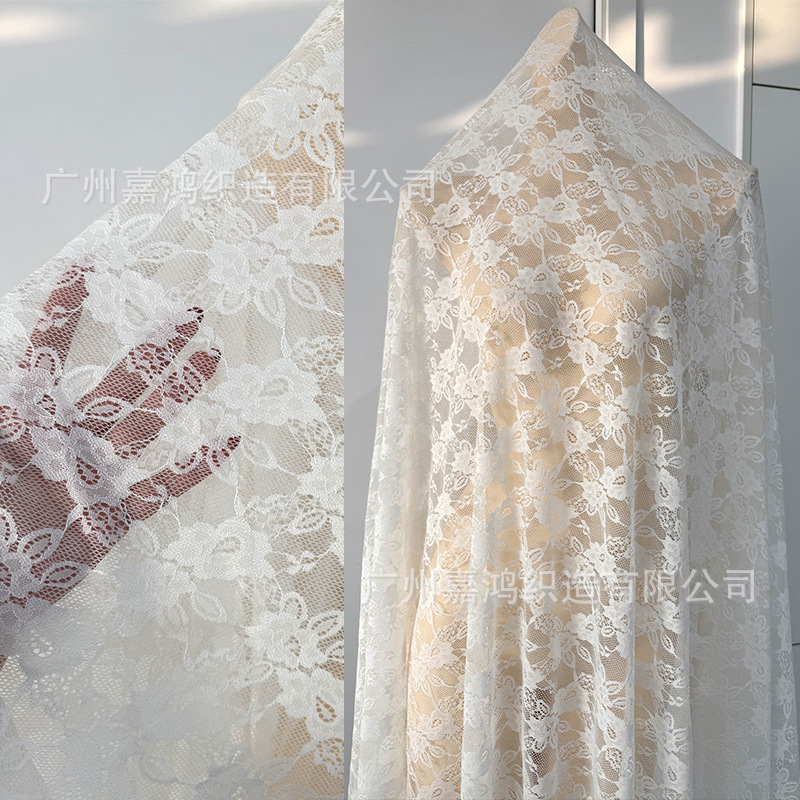 Primavera y verano nueva tela de encaje brocado amoniaco flores elásticas encaje hacer camiseta base vestido tela de encaje