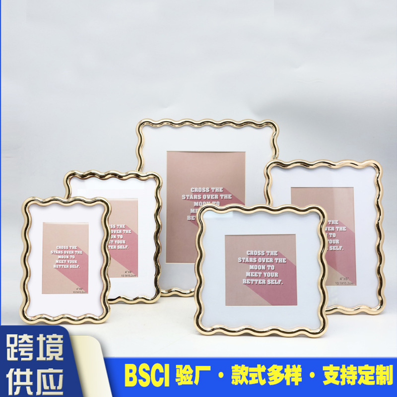 Factory wholesale cross-border zinc alloy wave-shaped photo frame table personalized creative home decoration gifts Factory wholesale cross-border zinc alloy wave-shaped photo frame table personalized creative home decoration gifts