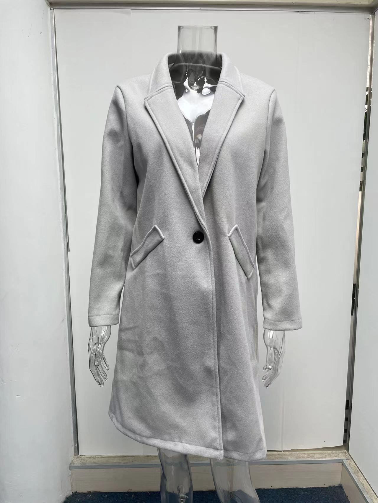 Title 14, Mid-length coat with solid lapels. Classic styl...