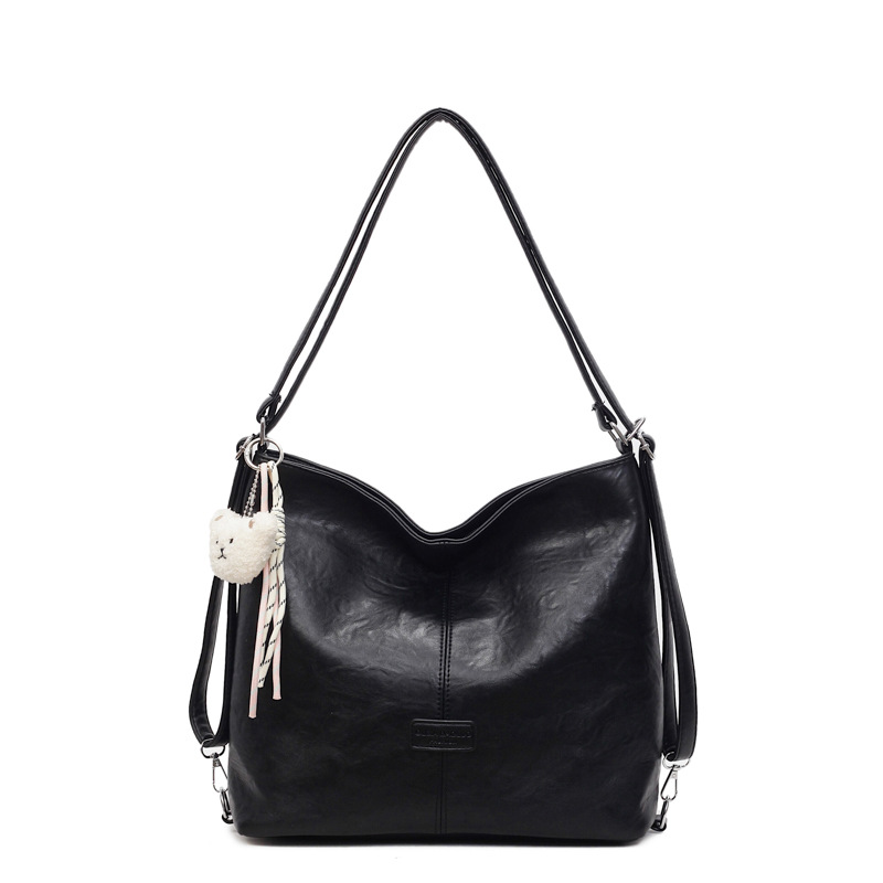 Bolsa de hombro retro transfronteriza de cuero suave de gran capacidad bolsa de cubo de agua para mujeres 2025 nueva simple mochila de viaje ocio