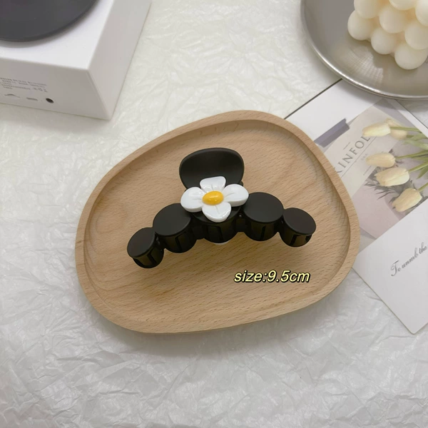 Flower-shaped, matte, black
