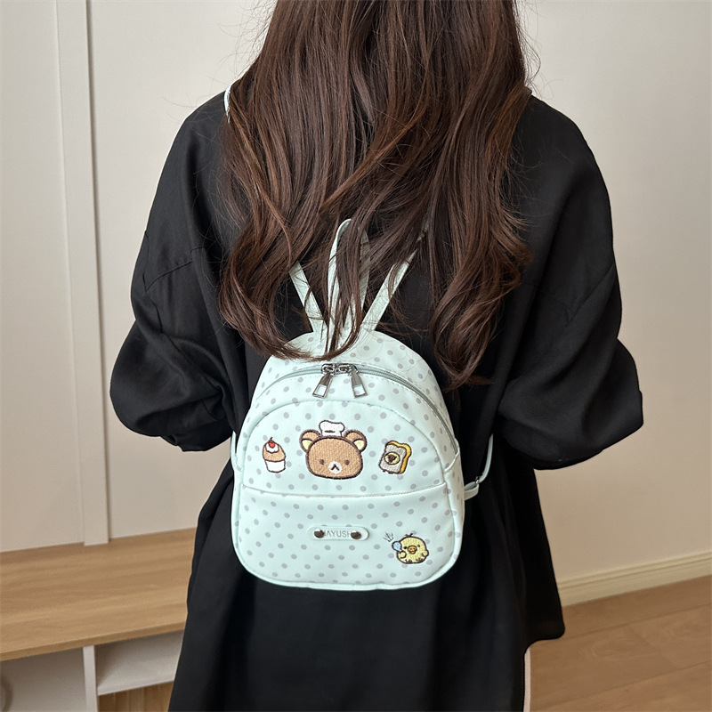 Nuevo lindo nicho de diseño ondulado punto mochila tendencia ocio femenina 2026 estilo extranjero viaje viaje mochila pequeña