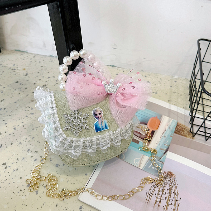 2025 nuevo bolso de perla para niños arco encantador caricatura cadena de estilo exterior bolsa de cambio de moda versátil