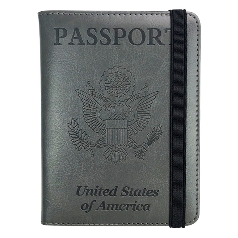 Traje de etiqueta de equipaje de cuero pu transfronterizo Clip de oro americano Hombres y mujeres Bolso de pasaporte de cuero universal Clip Correa pasaporte cubierta