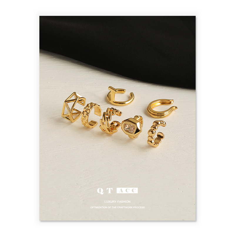 Latón chapado 18K oro real retro geométrico hueco diseño moda europea y americana temperamento earless pendientes clip de hueso del oído femenino