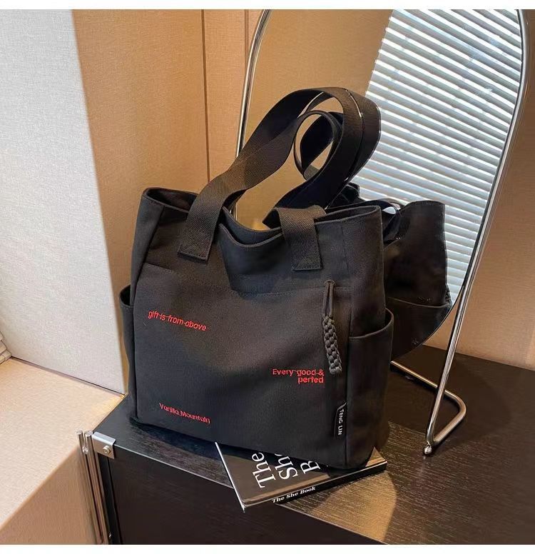 Bolsa de mano ligera para mujeres en clase de hombro único bolso de lienzo con cremallera de estilo coreano