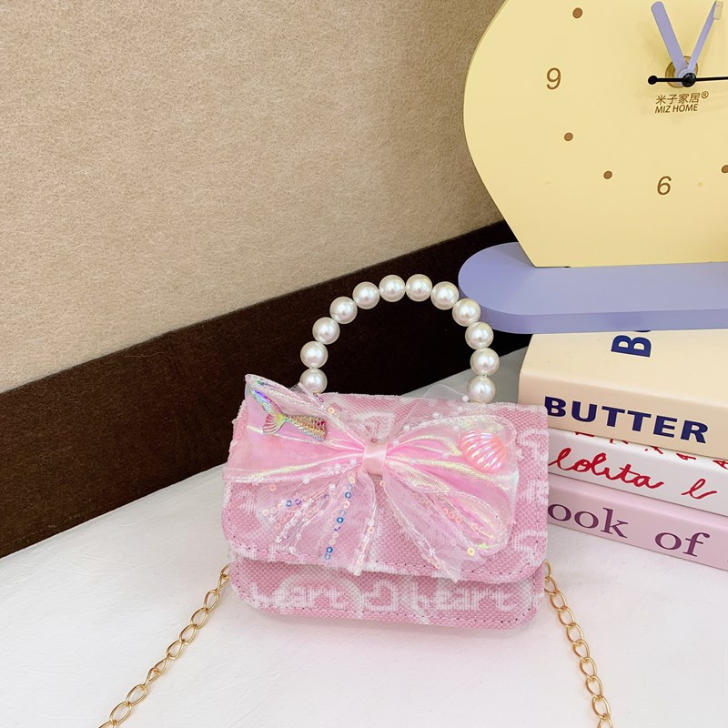 Nuevo bolso para niños niña arco de perla de hombro bolso de mano princesa de estilo extranjero mini bolso de cambio
