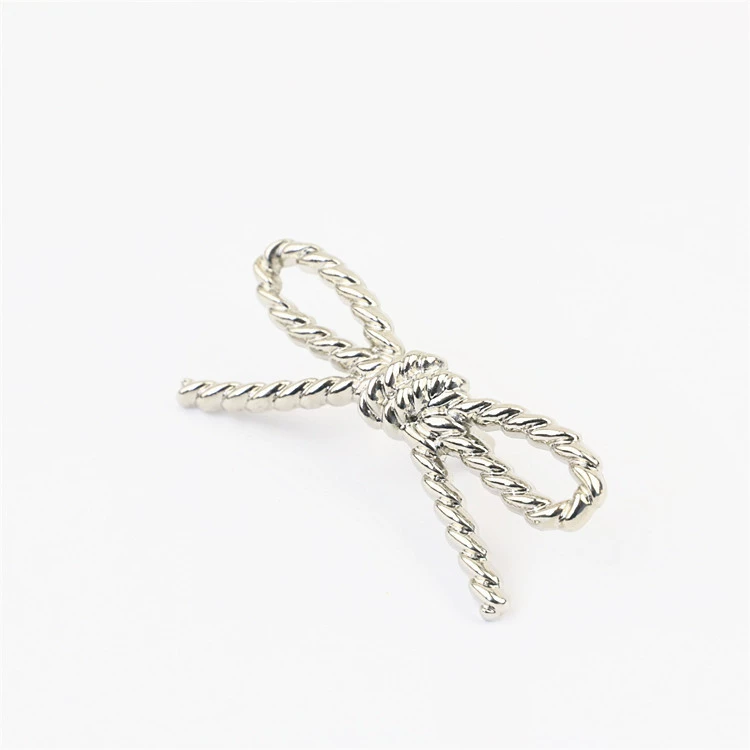Metal bag accessory with pigtail, footwear buckle with bow, shoes, decorations
