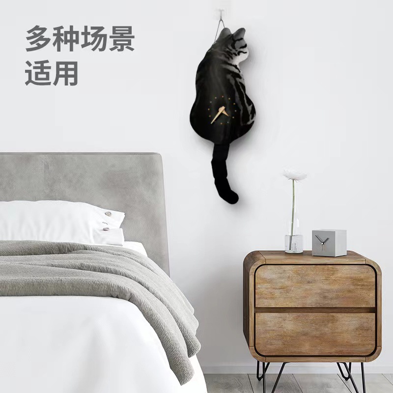 震え音が同じ揺れ尾猫掛け時計寝室掛け時計かわいいクリエイティブ猫時計はクリスマス元日の旧正月に備えている