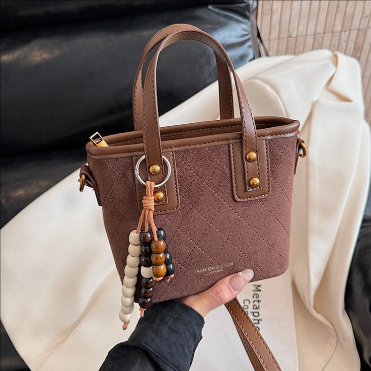 Nicho coreano Jeong seda bolso de balde de peluche mujeres otoño / invierno 2025 nuevo estilo versátil bolso de hombro bolso de alta calidad