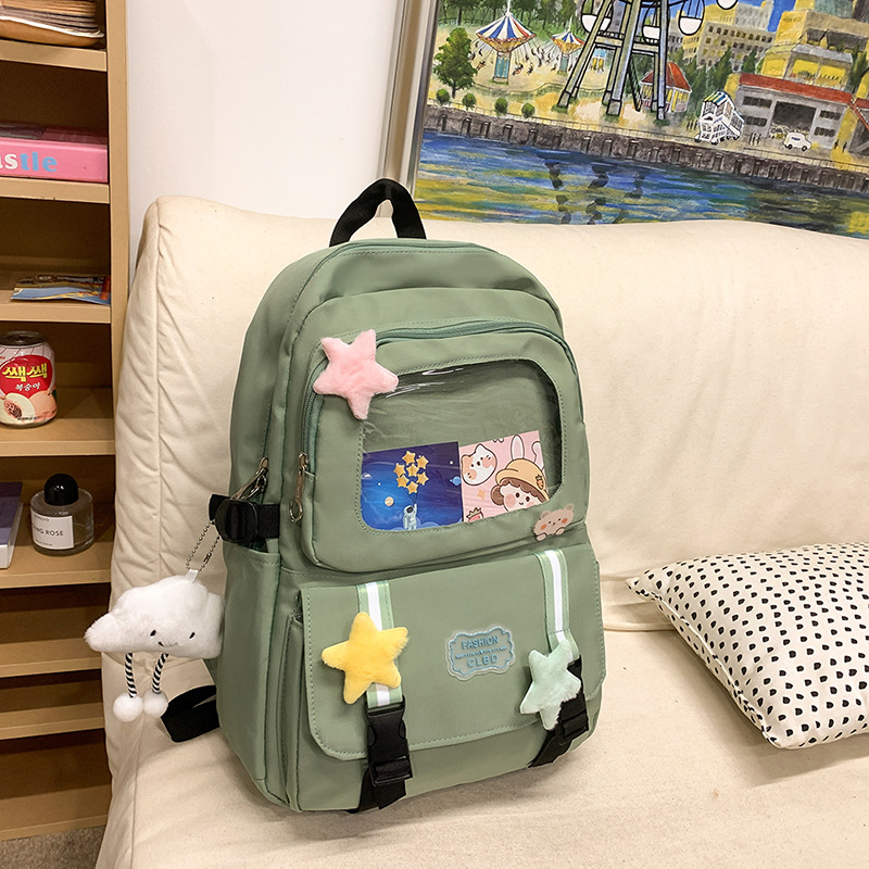 Mochilas escolares de moda bolsos de hombro para niñas estudiantes de primaria y secundaria sencillos paños transfronterizos ligeros bolsos de mano al por mayor bolsos de gran capacidad