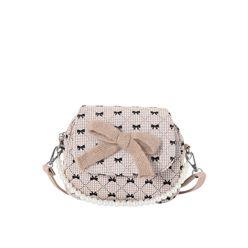 Arco encantador extranjero, bolso de hombro de niña, bolso de perla de diamante de moda, nuevo bolso de cambio para niños.