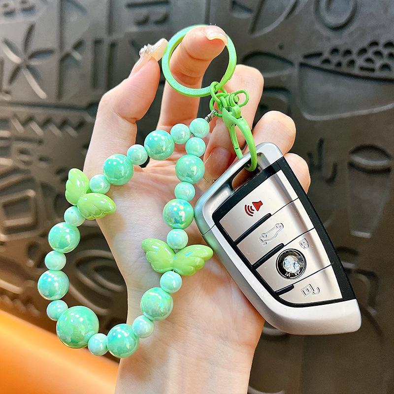 Sala de transmisión directa con alas recuerdos llaveros lindos colgantes de teléfonos móviles accesorios de bolsos llaveros de automóviles al por mayor