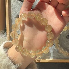 髪の毛の結晶のブレスレットのチタンの結晶の満髪の男女の天然のブラジルの髪の毛の結晶のブレスレットの黄色の水晶のブレスレットの黄色の結晶