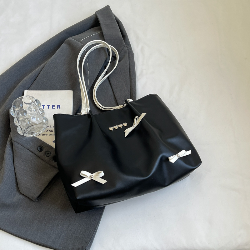 Este año popular bolso de viaje de moda coreana, bolso de hombro de estilo de ballet de mujer, textura alta, arco, bolso de mano.
