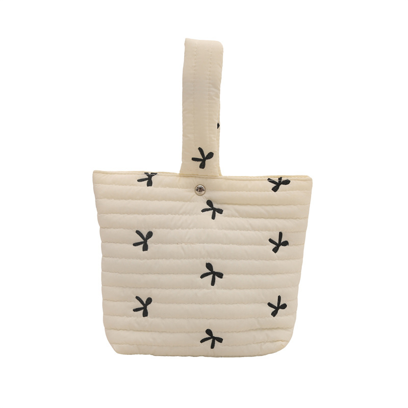 Moda coreana pequeña y fresca bolsa de bordado de arco de invierno 2024 nueva bolsa de maquillaje a rayas de diseño de nicho