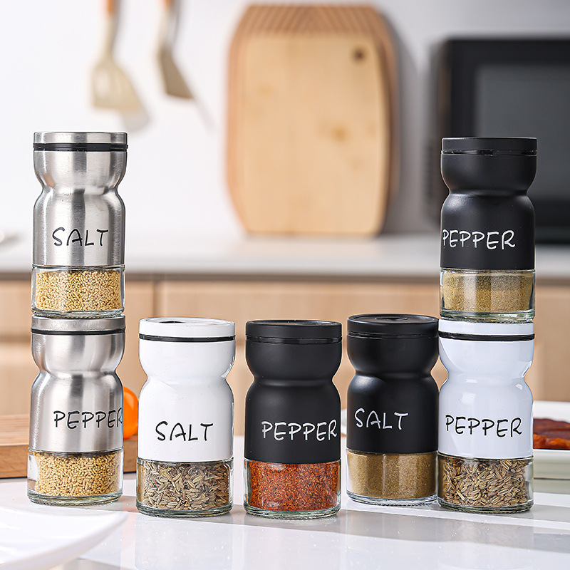 Botella de condimento transfronterizo de pimienta, sal y pimienta Botella de condimento redonda giratoria Combinación en blanco y negro Juego a prueba de humedad Tarro de condimento de vidrio