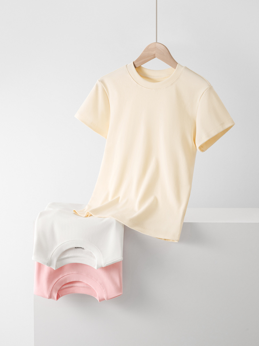 肩の半袖のtシャツの女性のフランスの丸首の2025夏の短いタイプの弾力の修身のギャルの風はやせている短い上着の女性を現します。