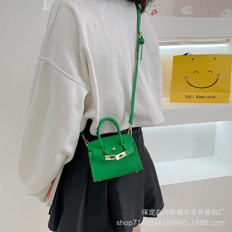 Bolsa para niños nueva pasarela europea y americana moda bolsa de platino estilo occidental niña bolsa de mensajero forma cóncava monedero comercio exterior
