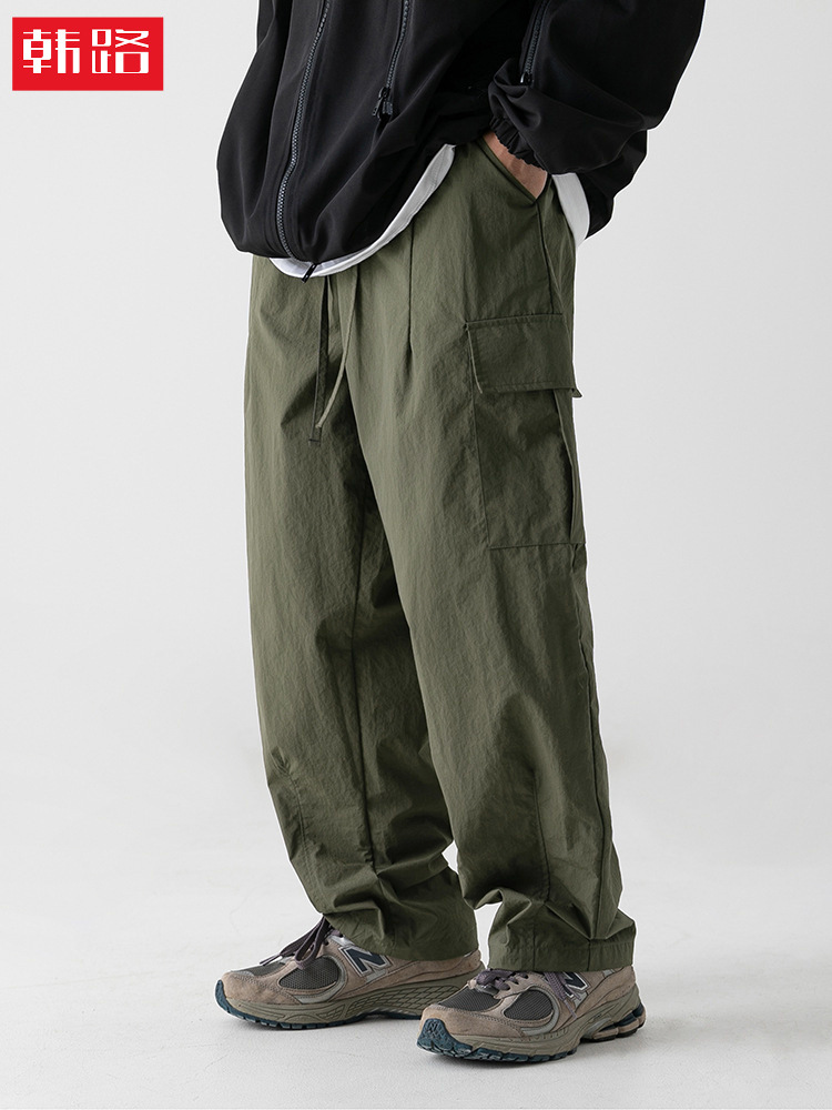 Pantalones de trabajo funcionales con textura ligeramente arrugada, repelentes al agua, estilo primavera, pantalones casuales japoneses para exteriores con pliegues sueltos y cordón ajustable.