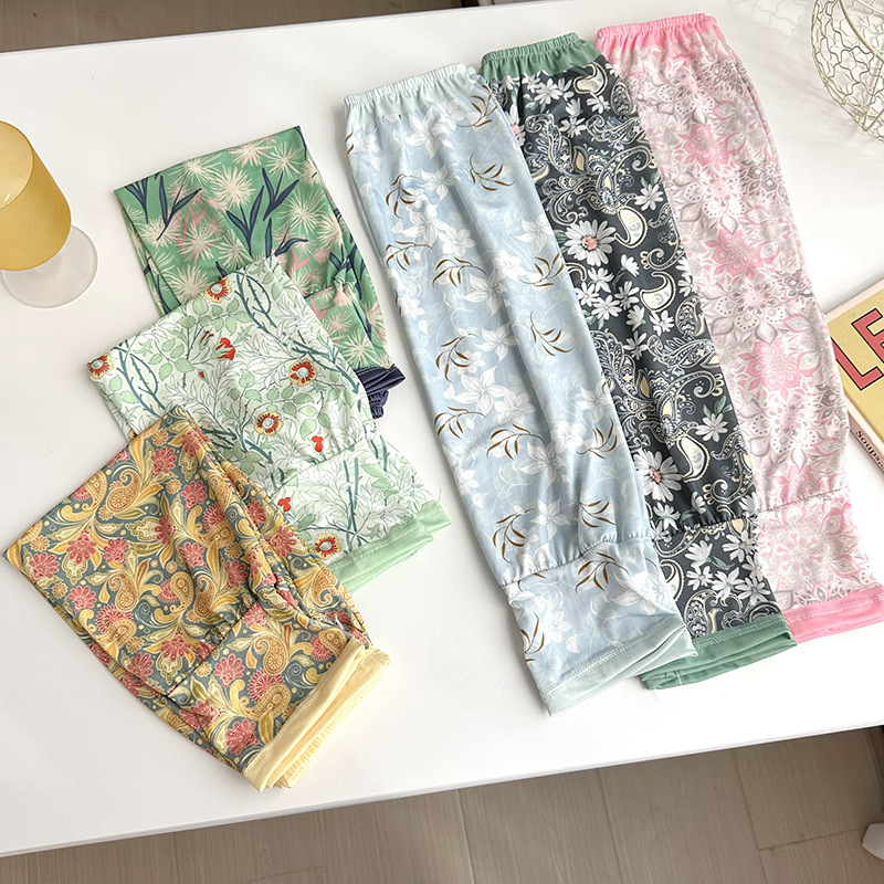 Mangas de protección solar para mujeres de verano nuevo estilo al aire libre anti-UV patrón de montar mangas de brazo de impresión de viento elegante