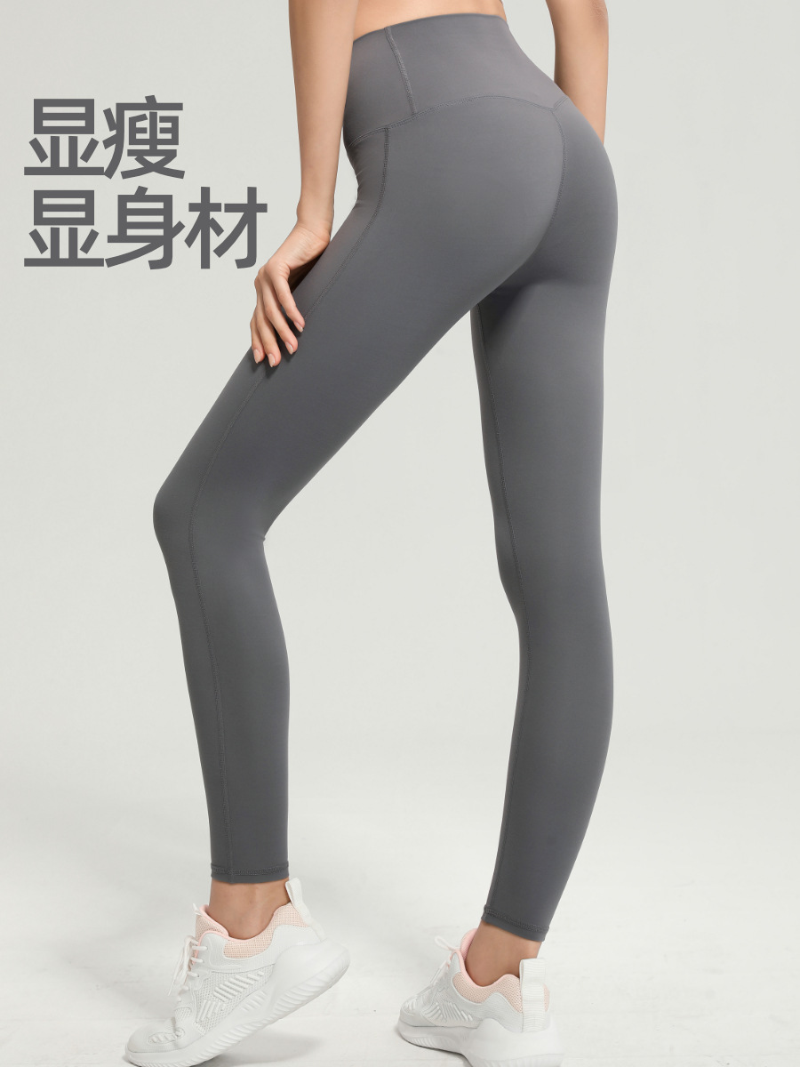 Nuevos pantalones de yoga de cintura alta de melocotón europeo y americano pantalones de barbie de deportes ajustados de las mujeres pantalones de fitness de secado rápido