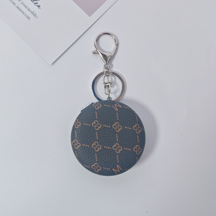 Bolsa de espejo popular en línea colgante de lujo ligero llavero portátil espejo de maquillaje transfronterizo colgante de bolsas de espejo doble cara