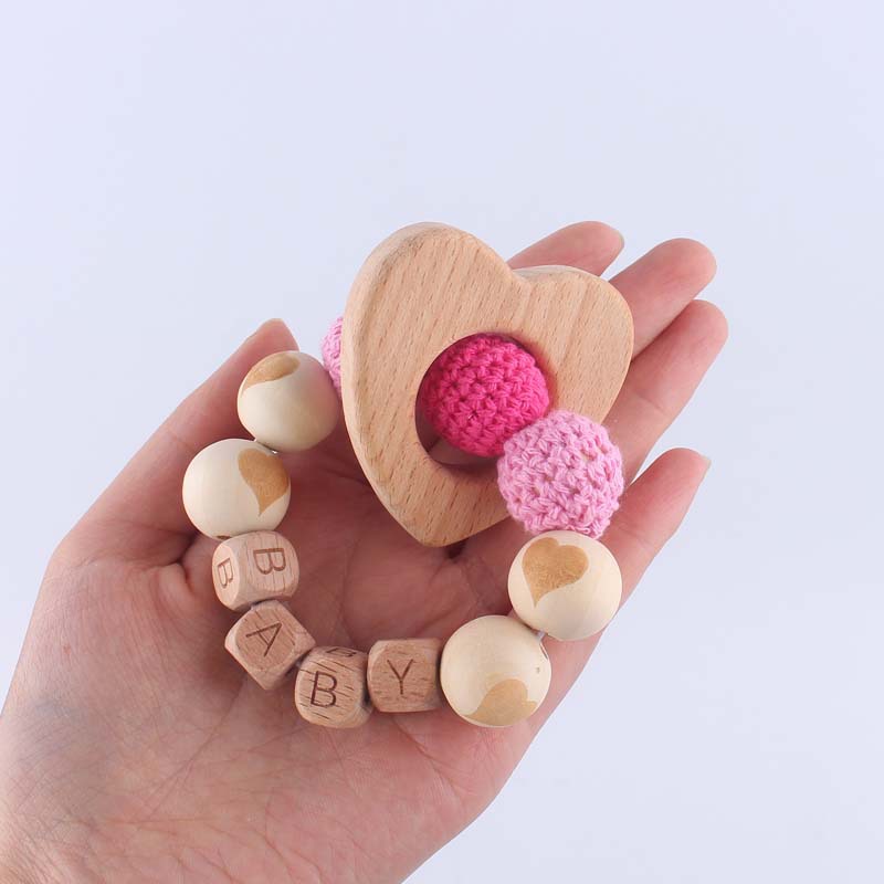 Bebé suministros de dibujos animados de haya amor mordedor creativo DIY dibujos animados amor patrón mordedura pulsera teether juguete