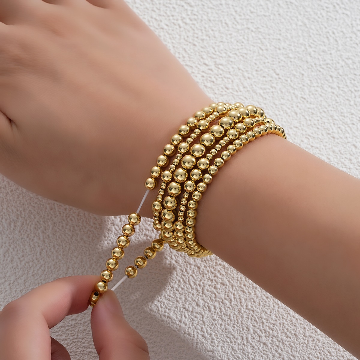 Amazon venta caliente pulsera de cuentas de oro real pulsera elástica galvanizada simple Europa y América 5 piezas conjunto de pulsera de cuentas