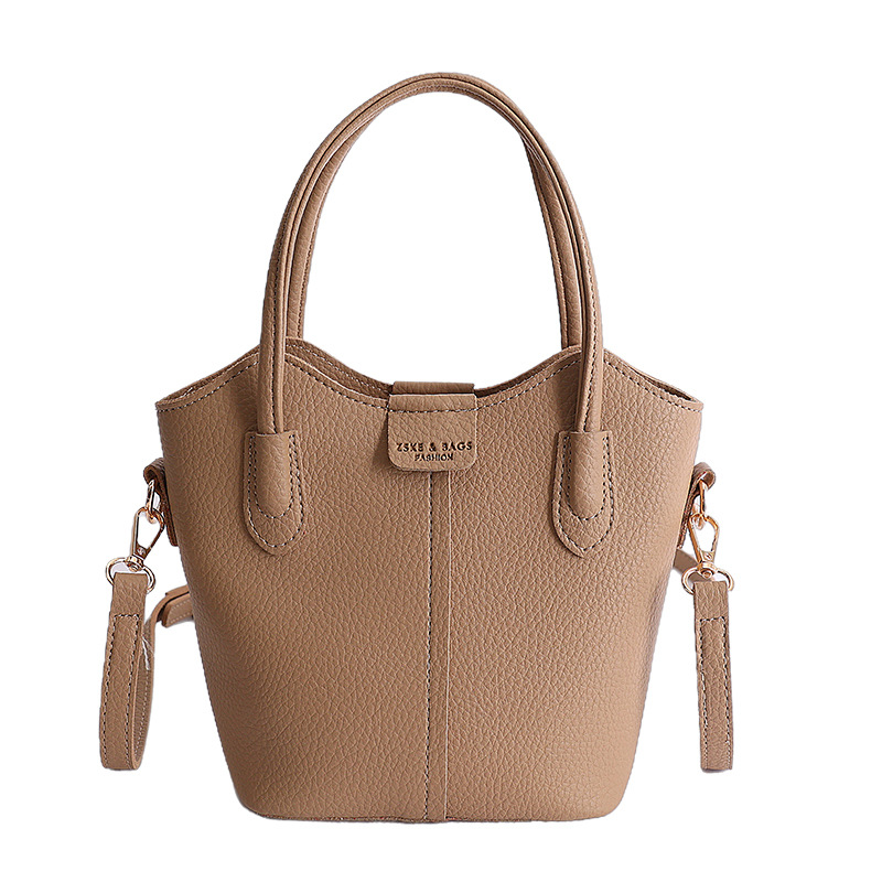 Bolso de mano de moda retro 2026 nuevo temperamento simple bolso de cubo de viaje ocio mochila de hombro