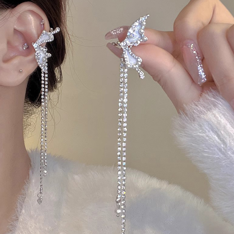 Diseño de nicho de alta gama borla larga sin orejas clip de oreja elegante estilo occidental de las mujeres cara-mirando pequeños nuevos pendientes de moda